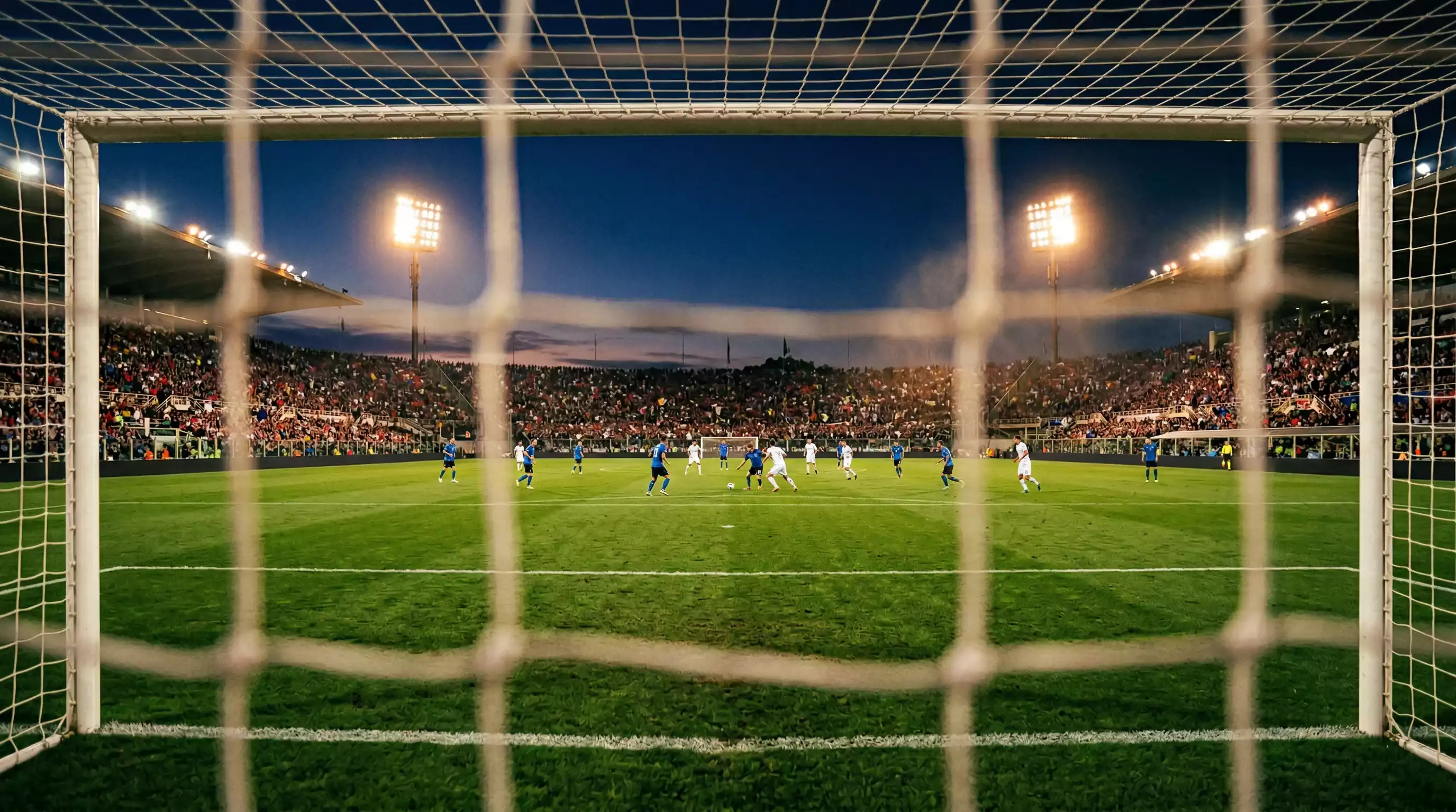 Champions-League-Abend im Fußballstadion mit Flutlicht und europäischen Flaggen